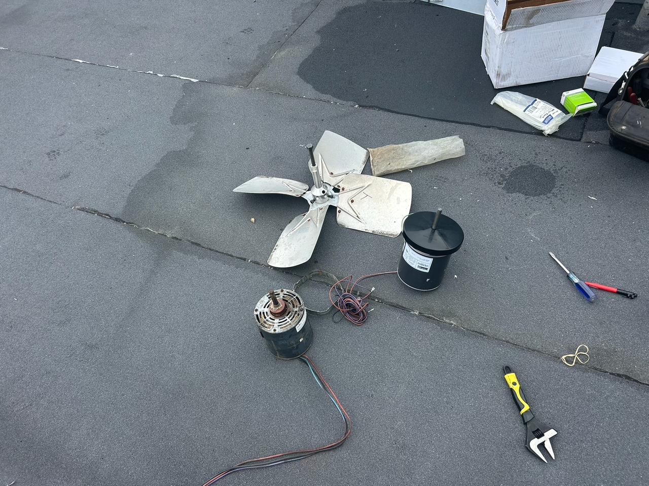 Rusted condenser fan blade on rooftop unit