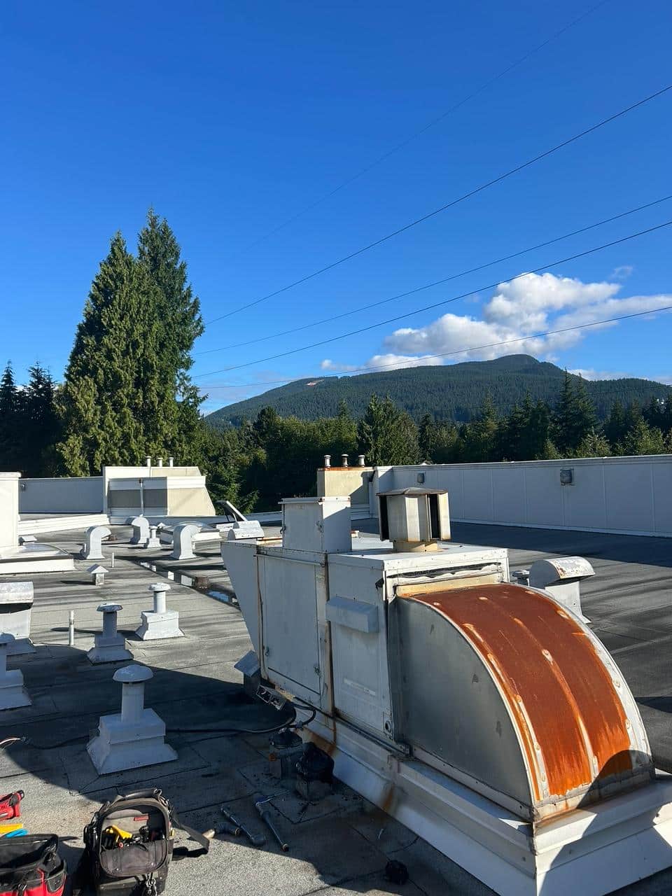 Old gas-fired make-up air unit on a North Vancouver condo rooftop before replacement by Air Solutions Mechanical